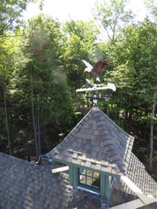 A bird's eye view of the cupola in place with its eagle weathervane. Source: YFI Custom Homes