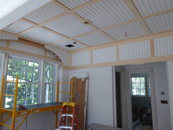 This coffered and beadboard ceiling in a guest bedroom demonstrates the level of detail that is incorporated in each room of the residence. Source YFI Custom Homes