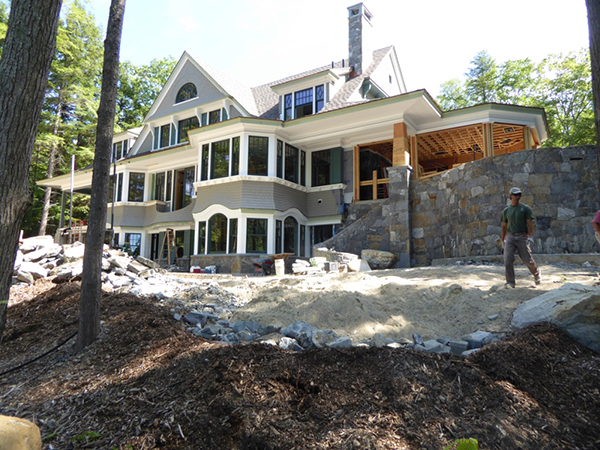 The rear façade comes alive with the addition of pre-dipped cedar shingles. Source: YFI Custom Homes